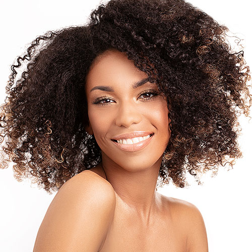 African American Woman posing and smiling | DermaplaneFacials